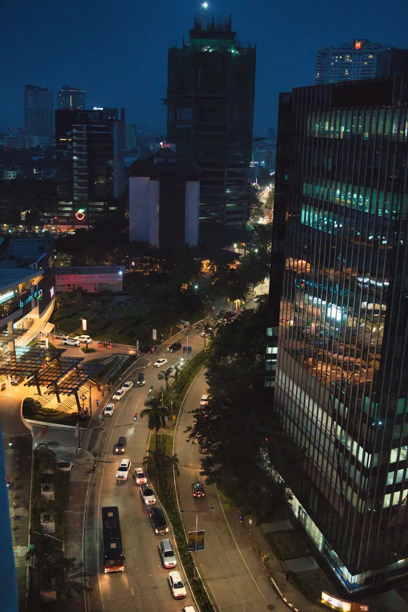 Cebu City at dusk with lit office towers and traffic below
