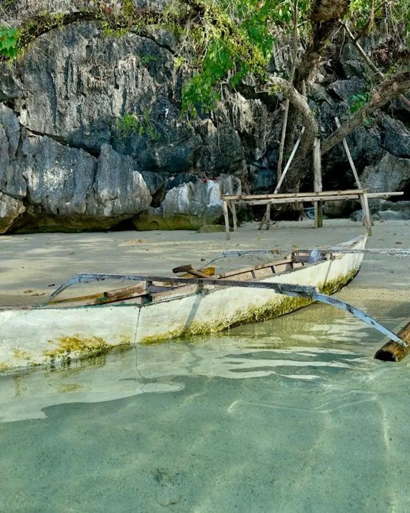 Longtail boats pulled up on the shore near Sabang